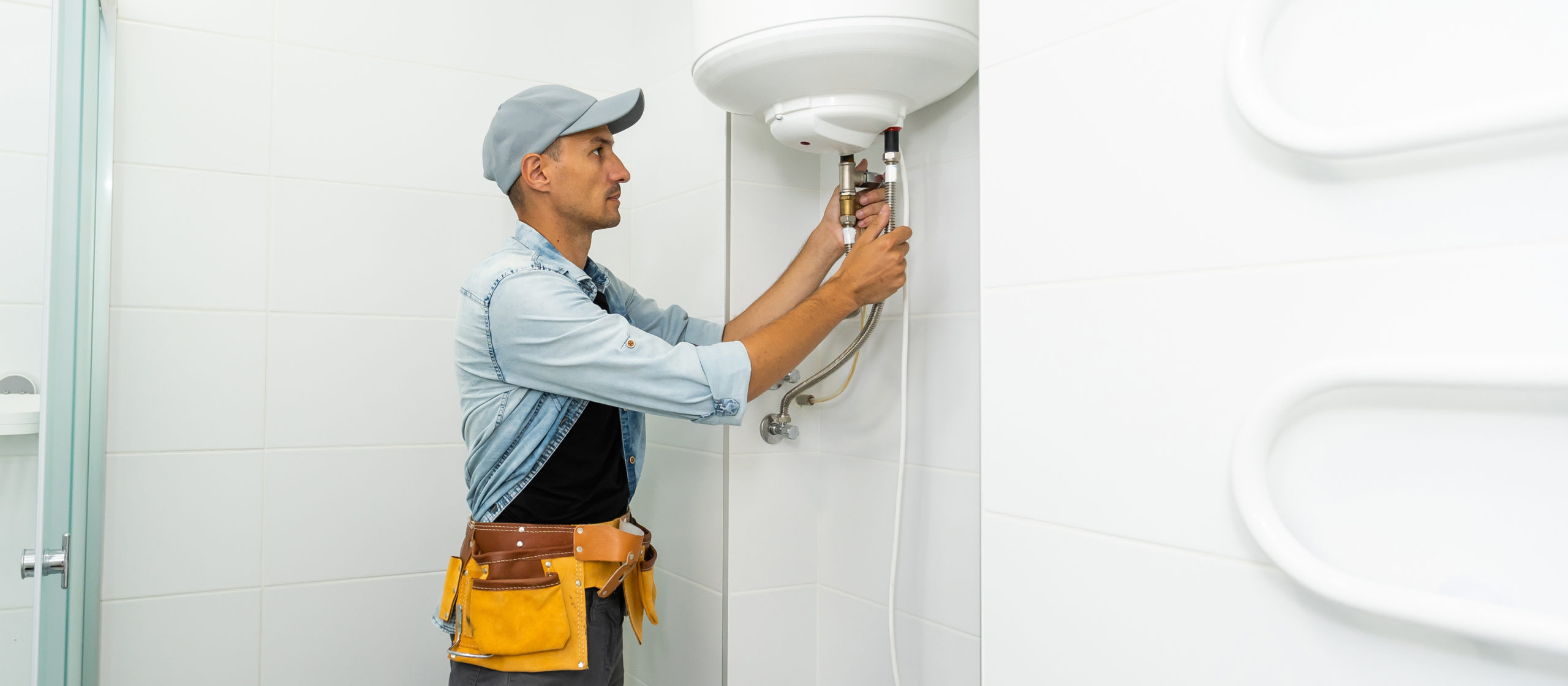 Plumber repairing an hot-water heater